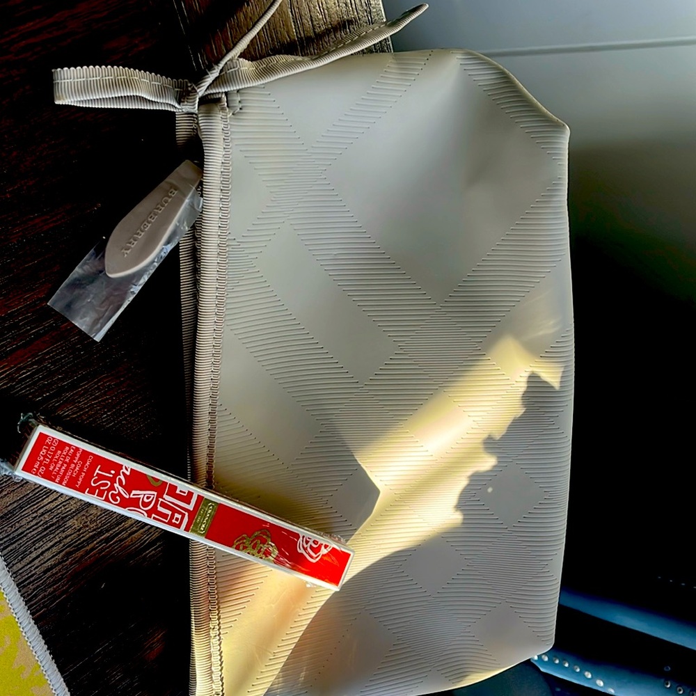 Burberry bag and Coach Poppy Blossom rollerball parfum